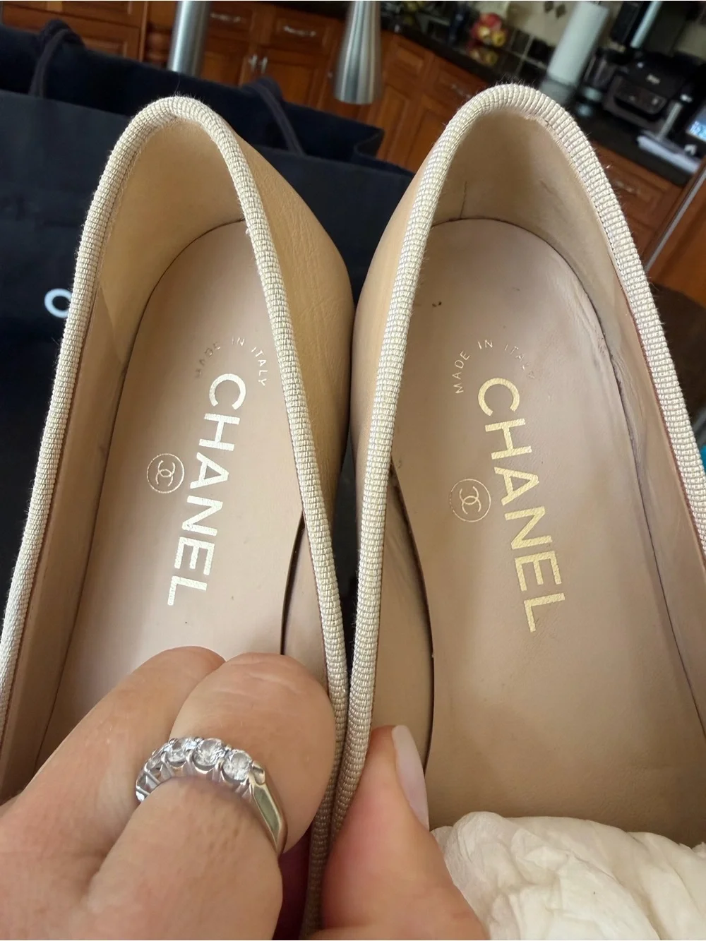 CHANEL Two-Tone Tan and Black Leather Cap-Toe Ballet Flats